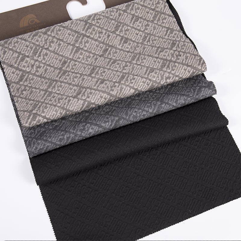 Dombornyomott betűs twill kötött jacquard poliészter viszkóz spandex sportruházati szövetek ruházathoz AW23016
